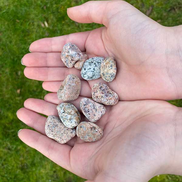 Stones held by set of hands